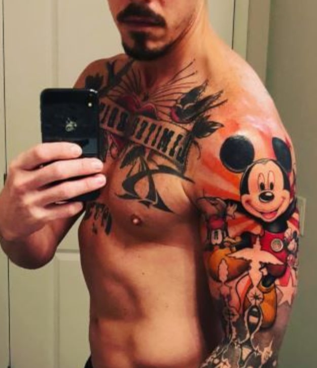 Image of David Bromstad showing his chest and arm tattoos